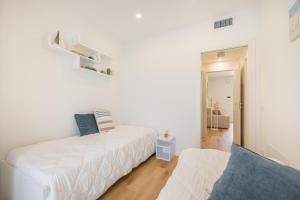 Postel nebo postele na pokoji v ubytování Wave Island MD F4 + 14 fotografií