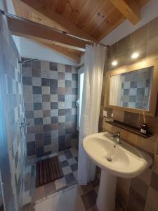 a bathroom with a sink and a shower at Villa Plaka 16 - 'The Roof' - Drepano, Nafplio in Dhrepanon