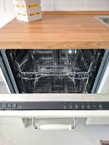 A kitchen or kitchenette at CASA del SOLE APARTMENTS with garden