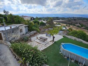 an external view of a house with a swimming pool at HideAway Lasa in Lasa