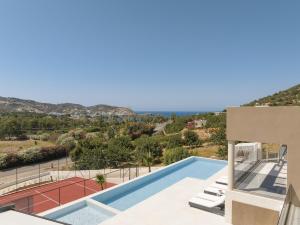 a villa with a swimming pool and a view at Dias Villa, Tennis, 2Pools, Walk to Beach & Shops, By ThinkVilla in Vlikhádha
