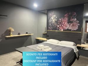 A bed or beds in a room at Davis Kaizen