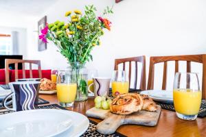 a table topped with a table with a vase of flowers at Elstree Luxury Hse Contractors, Family, Industrial Area Harry Porter in Hemel Hempstead