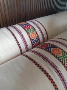 a close up of a blanket on a bed at HideAway Lasa in Lasa