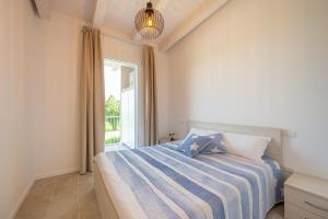 Ένα ή περισσότερα κρεβάτια σε δωμάτιο στο Wave Island Torre B23