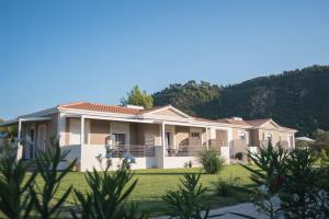 a house with a mountain in the background at Casa di Varco in Lefkada Town