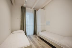 Postel nebo postele na pokoji v ubytování Wave Island Vice D9 + 5 fotografií