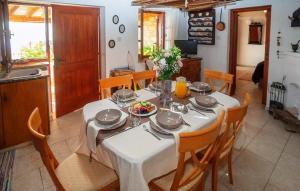 a dining room table with a white table cloth and chairs at HideAway Lasa in Lasa