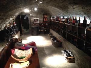 a wine cellar filled with lots of bottles of wine at Los Siete Reyes in Aínsa