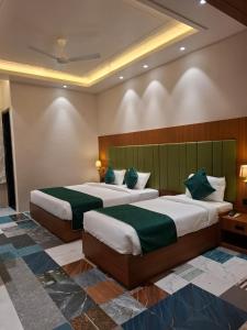 Postel nebo postele na pokoji v ubytování Hotel Bliss Banaras