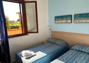 Postel nebo postele na pokoji v ubytování Residence Talamone Il Poderino + 29 fotografií