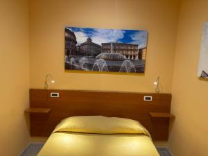 Postel nebo postele na pokoji v ubytování Albergo Parigi + 37 fotografií