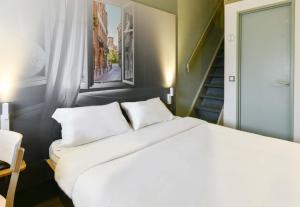 Postel nebo postele na pokoji v ubytování B&B HOTEL Toulouse Cité de l'Espace Mouchotte + 37 fotografií