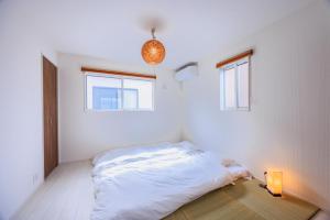 Letto o letti in una camera di House FORMOSA中島