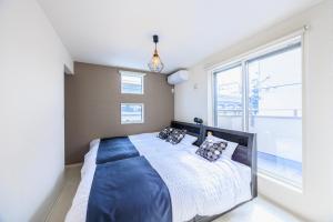 Letto o letti in una camera di House FORMOSA中島