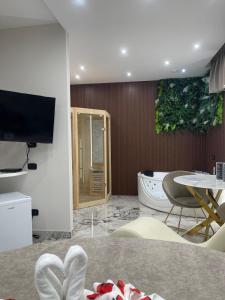 TV a/nebo společenská místnost v ubytování Hotel Manuela