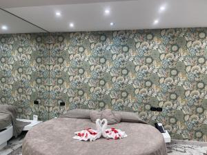 Postel nebo postele na pokoji v ubytování Hotel Manuela