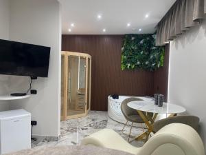 TV a/nebo společenská místnost v ubytování Hotel Manuela