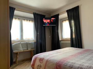 Posteľ alebo postele v izbe v ubytovaní Baita Carmen Bormio