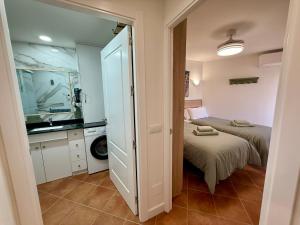 Postel nebo postele na pokoji v ubytování APARTAMENTO EN EL CENTRO CERCA DE La PLAYA