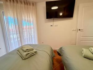 TV a/nebo společenská místnost v ubytování APARTAMENTO EN EL CENTRO CERCA DE La PLAYA