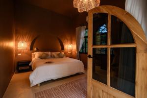 Postel nebo postele na pokoji v ubytování Botanica Villas + 37 fotografií