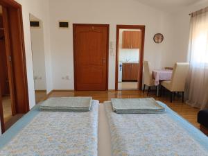 Postel nebo postele na pokoji v ubytování Studio Apartman Totus Tuus