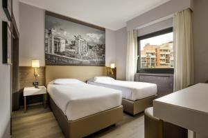 Postelja oz. postelje v sobi nastanitve Hotel Marc'Aurelio