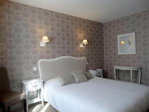 Cama ou camas em um quarto em Castel Fleuri
