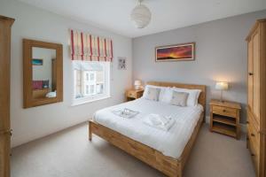 Postel nebo postele na pokoji v ubytování Windward cottage