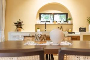 a table with a vase and a box on it at Botanica Villas Koh Chang by Indie Beach in Ban Khlong Kloi +93 photos
