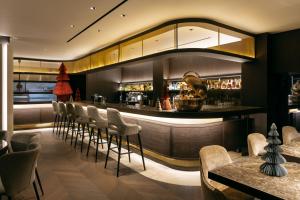 a bar in a restaurant with chairs and tables at Divani Palace Acropolis in Athens +38 photos