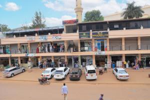 a group of cars parked in front of a building at Hermela Guest House Old Kampala in Kampala +7 photos