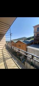 a balcony with a view of a building at TRIBU apart hotel in Bakuriani