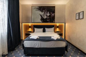 Postel nebo postele na pokoji v ubytování Hotel Astral