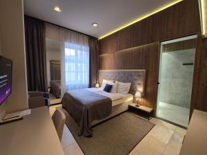 Ένα ή περισσότερα κρεβάτια σε δωμάτιο στο Central Luxury Zagreb
