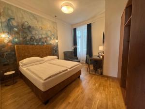 Letto o letti in una camera di Hotel Secession an der Oper