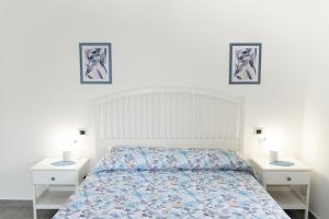 A bed or beds in a room at La Terrazza Azzurra