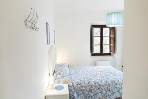 A bed or beds in a room at La Terrazza Azzurra
