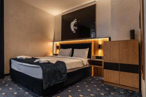 Postel nebo postele na pokoji v ubytování Hotel Astral