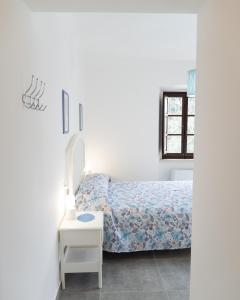 A bed or beds in a room at La Terrazza Azzurra