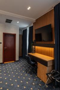 TV a/nebo společenská místnost v ubytování Hotel Astral