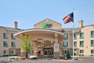 an exterior view of a hotel with an american flag at Holiday Inn Express & Suites Nampa - Idaho Center by IHG in Nampa