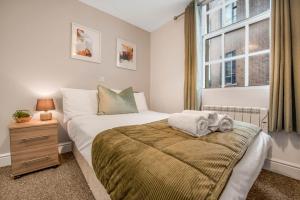 a small bedroom with a bed and a window at WhiskAwayHomes - Jenkins House - Studio 2 in Worcester
