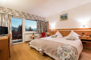 Postel nebo postele na pokoji v ubytování Hotel Ad'Eldorado