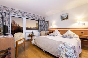 Letto o letti in una camera di Hotel Ad'Eldorado