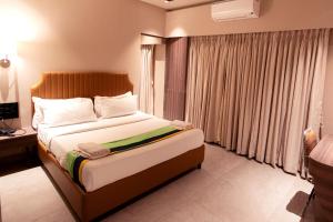 Postel nebo postele na pokoji v ubytování HOTEL GOLDEN TULIPZ