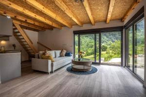 a living room with a couch and a table at Zora - moje mjesto in Konjic +69 photos