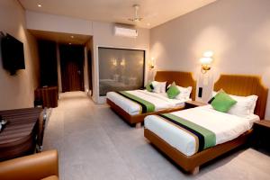 Postel nebo postele na pokoji v ubytování HOTEL GOLDEN TULIPZ
