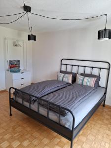 a bedroom with a bed in a room at Wohnung mit Herz in Schwyz